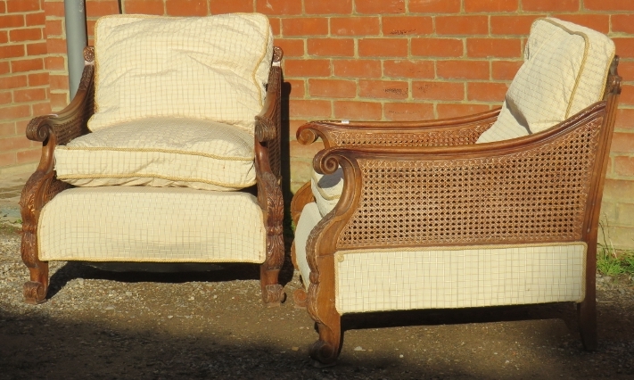 A pair of early/mid 20th century Bergere armchairs, having ornately carved show-wood frames, - Image 3 of 3