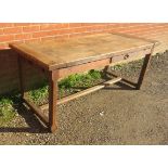 A 19th century rustic French farmhouse kitchen table of good patina, having a side drawer and an end
