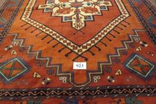 A Fine 20th Century Turkish Afghan Kunduz carpet. Central Medallion on red/burnt amber ground