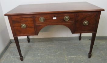 A 19th century mahogany writing desk, having one short drawer flanked by two cock-beaded deep