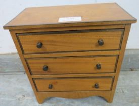 A George III style satin walnut apprentice chest, 20th century, 22cm wide x 23cm high.