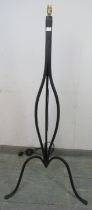 An ornate wrought iron standard lamp, no shade. H144cm (approx). Sold electronically untested.