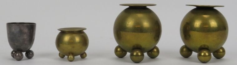 Three vintage brass candlesticks of cauldron form attributed to Naum Slutzky, in the Bauhaus