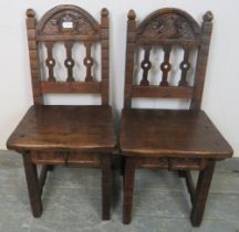 A pair of 17th century style fruitwood child's chairs, 20th century. Having carved top rails and