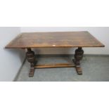 An early 20th century Elizabethan revival carved oak refectory/dining table rectangular top above