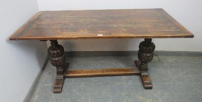 An early 20th century Elizabethan revival carved oak refectory/dining table rectangular top above