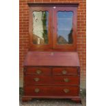 A Georgian mahogany bureau bookcase, the top section with two height-adjustable shelves above