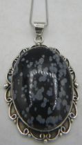 A large bezel set oval Obsidian pendant, approx size 53mm x 40mm, on a 24" chain, both marked 925.