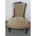 A late Victorian mahogany show-wood bedroom chair, reupholstered in patterned chenille material,