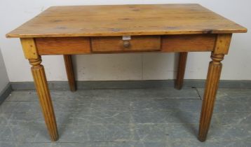 An antique stripped pine kitchen table, single frieze drawer, fitted legs. W112cm H74cm D67cm (