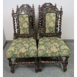 A set of four 19th century Carolean Revival carved oak dining chairs, with busy foliate