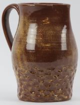A Susie Cooper brown glazed studio pottery jug, mid 20th century. Incised ’Susie Cooper England’