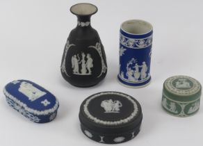 A group of five Wedgwood jasperware items, 19th/early 20th century. Comprising a black basalt