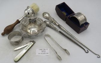 A silver bon bon dish with pierced decoration, Birmingham 1897. An engraved silver napkin ring,