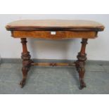 A Victorian figural walnut card table, the serpentine rectangular top with inverted rounded corners,