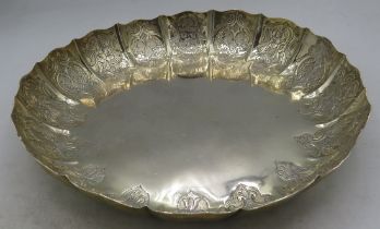 A Georgian silver circular strawberry dish with chased decorated panels, London 1822. Approx 9"/22cm