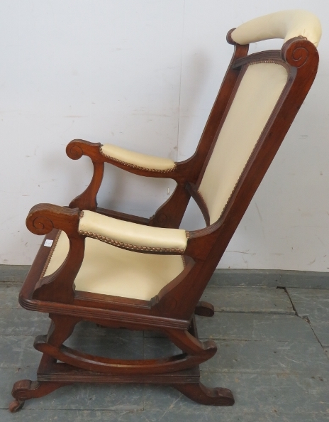 An early 20th century American mahogany ‘Dexter’ rocking chair, re-upholstered in cream leather with - Image 3 of 4