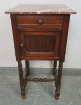 A vintage French fruitwood bedside cabinet with rouge marble top above single drawer and panelled