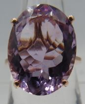 A large oval faceted cut amethyst ring, 20mm x 15mm approx, marked 925, size Q. Good cut, colour and