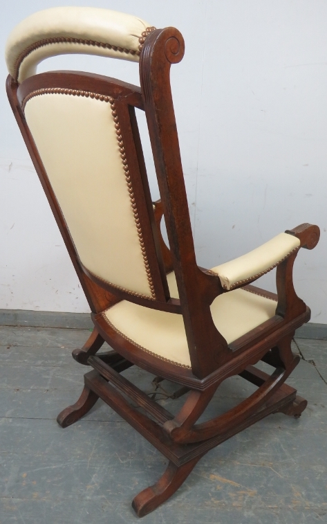 An early 20th century American mahogany ‘Dexter’ rocking chair, re-upholstered in cream leather with - Image 4 of 4