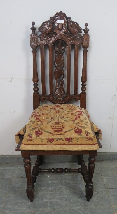 A 19th century Carolean Revival carved oak single chair/hall chair, with caned seat and machined