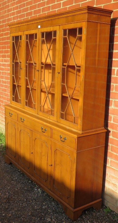 A reproduction yew wood library bookcase, having a dentil cornice above four astral glazed doors, - Image 3 of 3