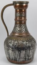 A large Middle Eastern metalwork decanter jug with embossed decoration, 19th century or earlier.