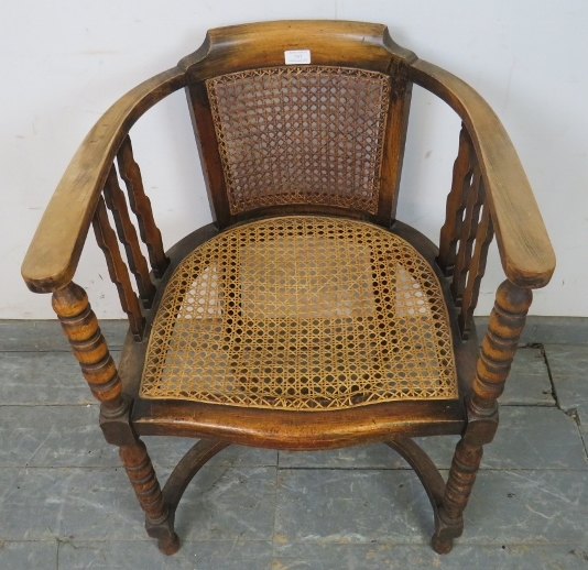 An antique fruitwood Continental bergère tub chair, the curved arms joined by shaped spindles and - Image 3 of 4