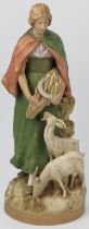 A Bohemian Royal Dux harvesting girl with goats figural group. Numbered 2595 with factory marks