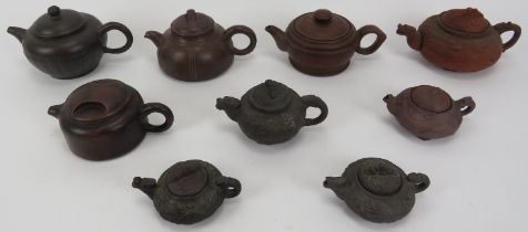 A group of Chinese yixing pottery teapots, 20th century. Comprising nine yixing pottery teapots each