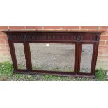 An Edwardian mahogany over mantle mirror, inset with three bevelled plates, decorated throughout