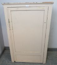 A vintage pine and plywood pantry cupboard painted cream, housing two loose shelves. H112cm W70cm