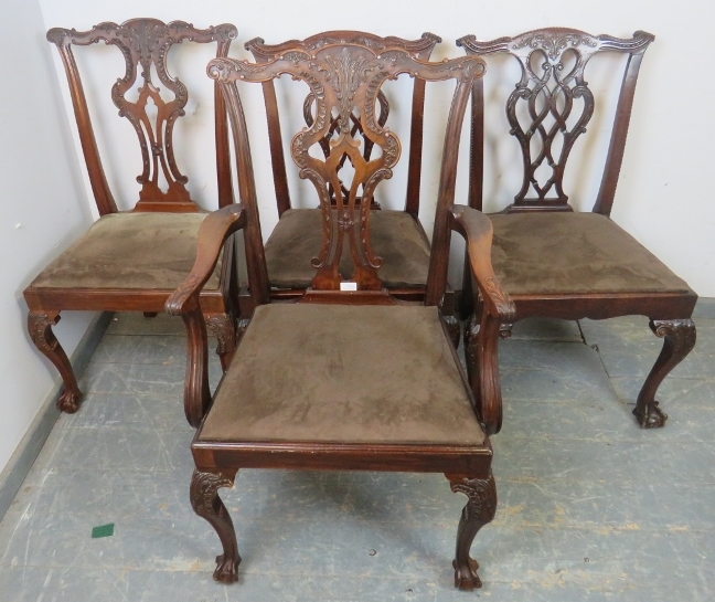 A set of four vintage Chippendale Revival mahogany dining chairs, comprising one carver and three