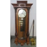 A 19th Century glazed walnut cased Vienna - type wall clock, the case of classical architectural