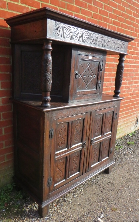 A 17th century and later oak court cupboard, the top section with central cupboard flanked by relief - Image 2 of 4