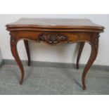 A good 19th century figured walnut serpentine fronted card table, with carved decoration, rear