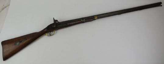 A percussion cap rifle, 19th century. Probably an Enfield rifle. With brass guard and mounts, the