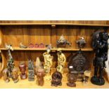 A selection of figurines, both African and Oriental