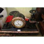 A black slate clock garniture with painted gilt highlights, with pendulum & key, 31cm high
