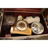 A retro suitcase containing two mantle clocks and mixed china various to include Clarice Cliff.