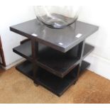 A black finished three tier coffee table