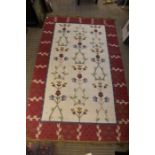 Kelim rug and two older rugs.