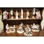 A wide selection of porcelain figurines, various makers.