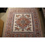 A square geometric patterned rug.