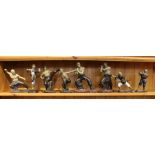 A shelf full of Martial Arts figurines