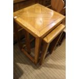 Two modern Oriental style light oak nesting tables