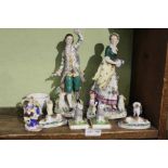 A selection of porcelain figurines, animal and human with a Meissen Cup.