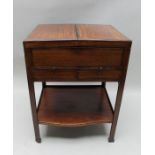 19th century mahogany and rose wood storage table having twin fold out top with fitted interior hous