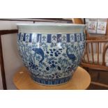 A modern blue and white oriental fish bowl planter