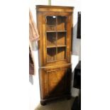 A mahogany reproduction full height corner cupboard, glazed top section
